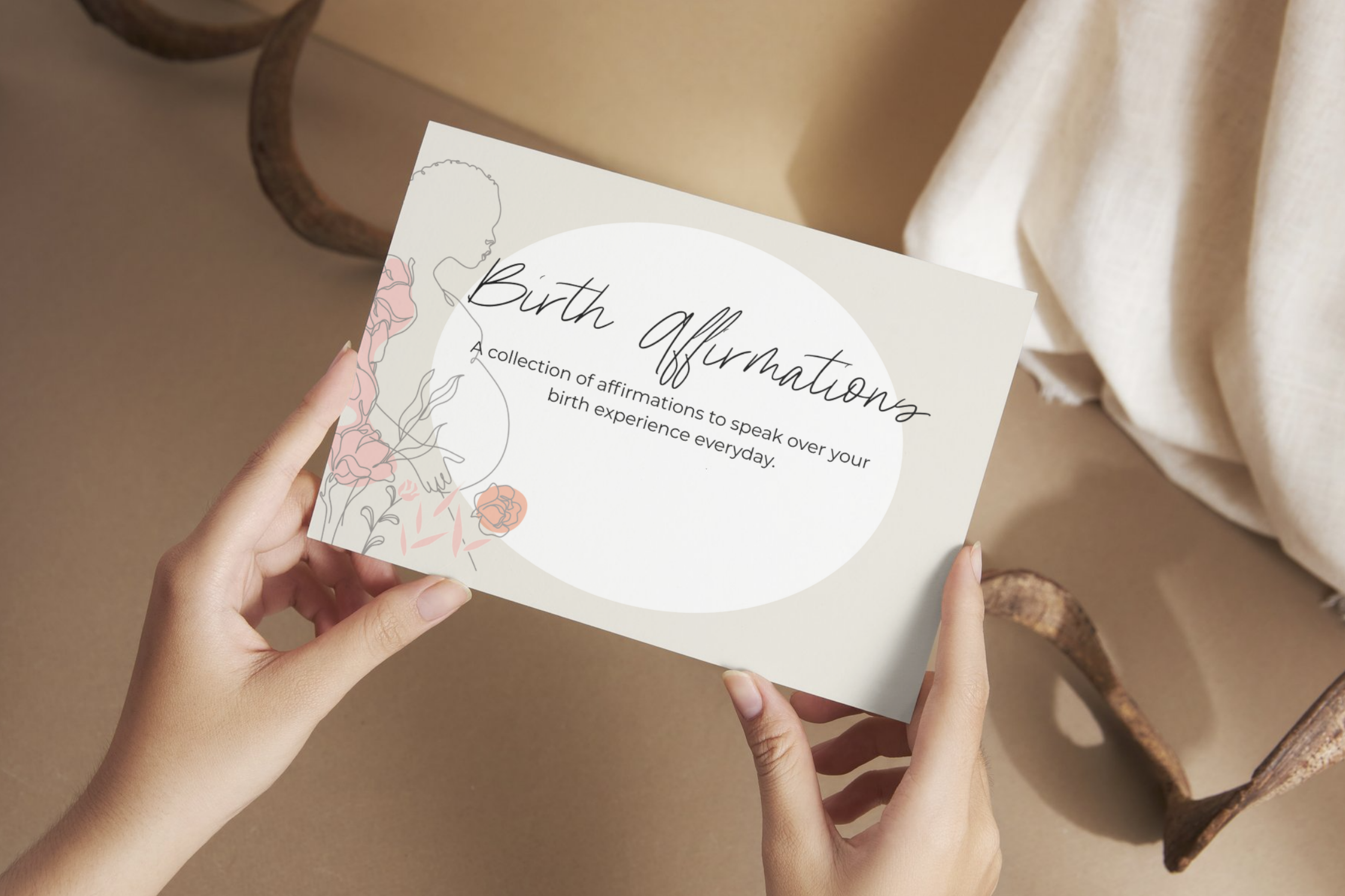 Hands holding a birth affirmation card